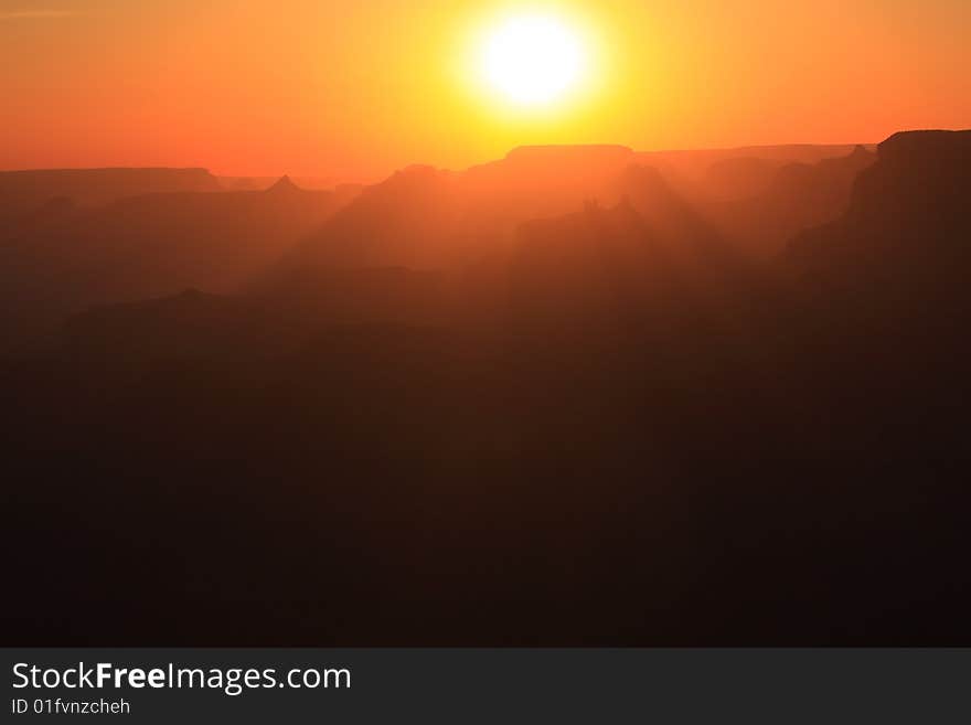 The sun setting over the Grand Canyon National Park, Arizona. The sun setting over the Grand Canyon National Park, Arizona.