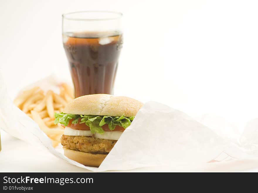 Crisp chicken burger with tomato onion cheese lettuce isolated. Crisp chicken burger with tomato onion cheese lettuce isolated