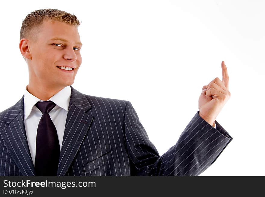 Portrait of smiling pointing businessman on an isolated white background