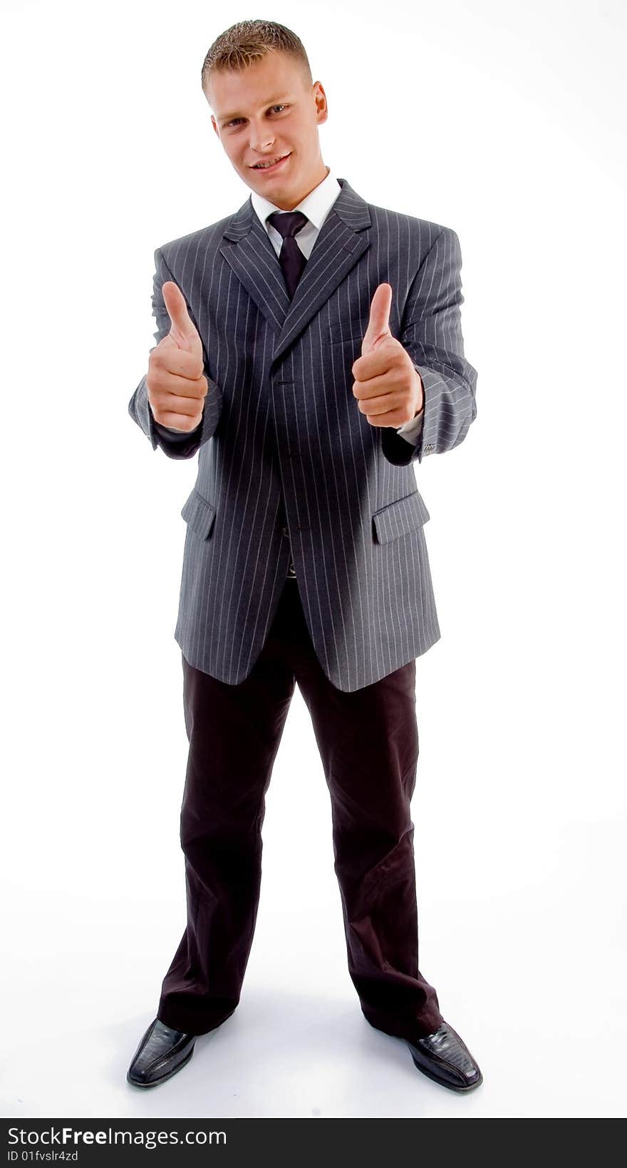 Standing businessman with thumbs up on an isolated white background