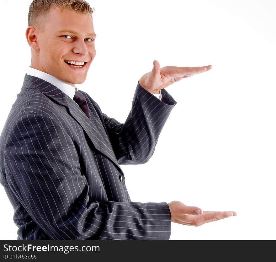 Young smiling businessman measuring on an isolated white background