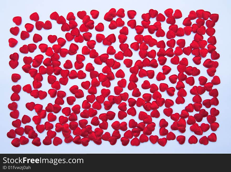 Small red hearts made from cloth. Small red hearts made from cloth.