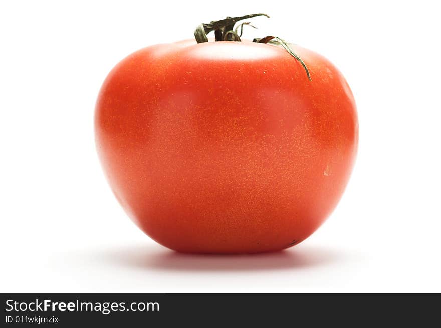 Large red tomato isolated on a white background.