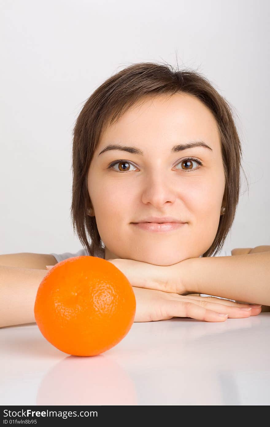 Girl with orange, shot in studio