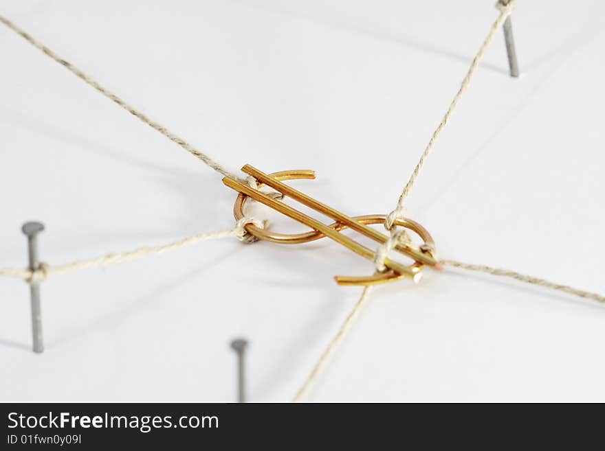 Dollar sign constrained with ropes and nails isolated on white. Dollar sign constrained with ropes and nails isolated on white