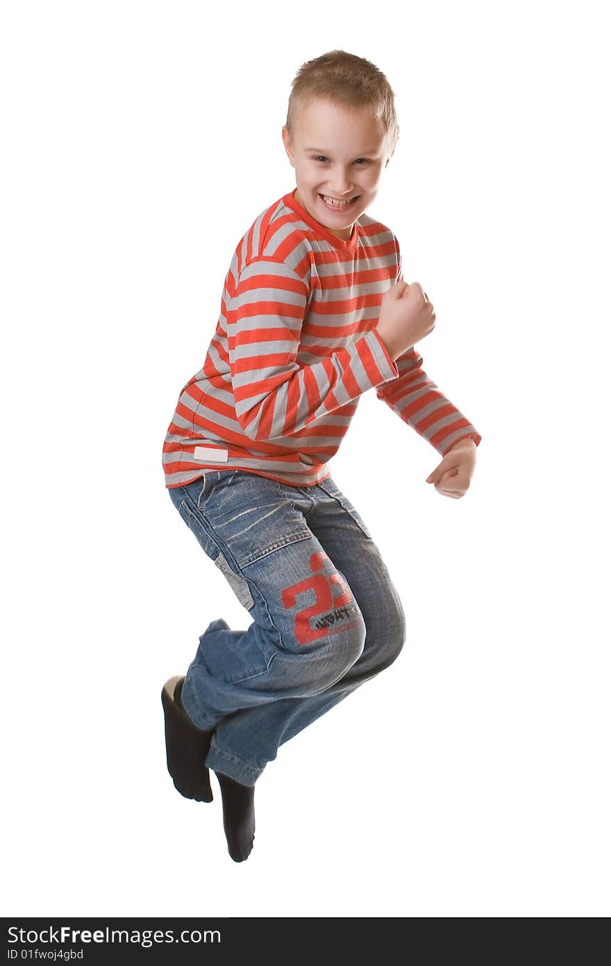 Young boy jumping isolated on a white background. Young boy jumping isolated on a white background