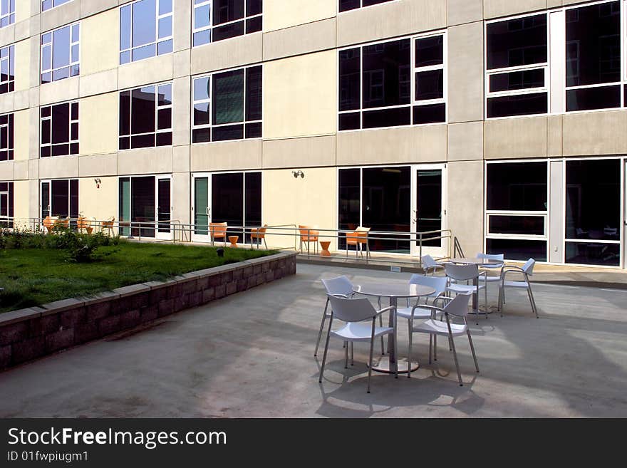 A modern loft courtyard with tables and chairs