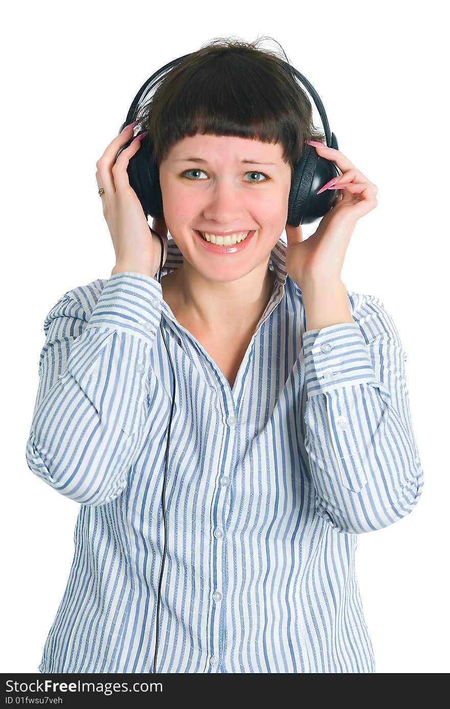 The girl listens to music on a white background