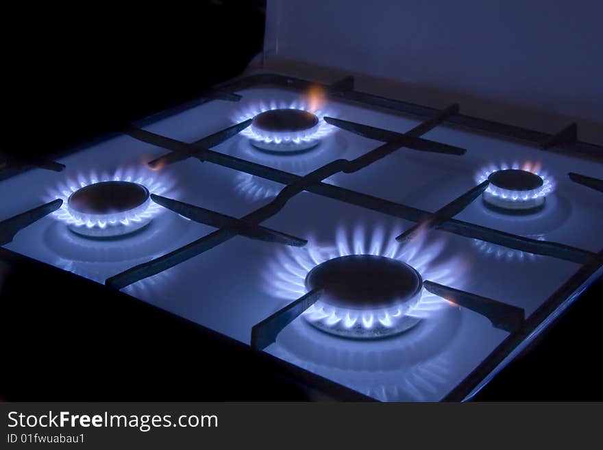 Flames of gas stove in the dark