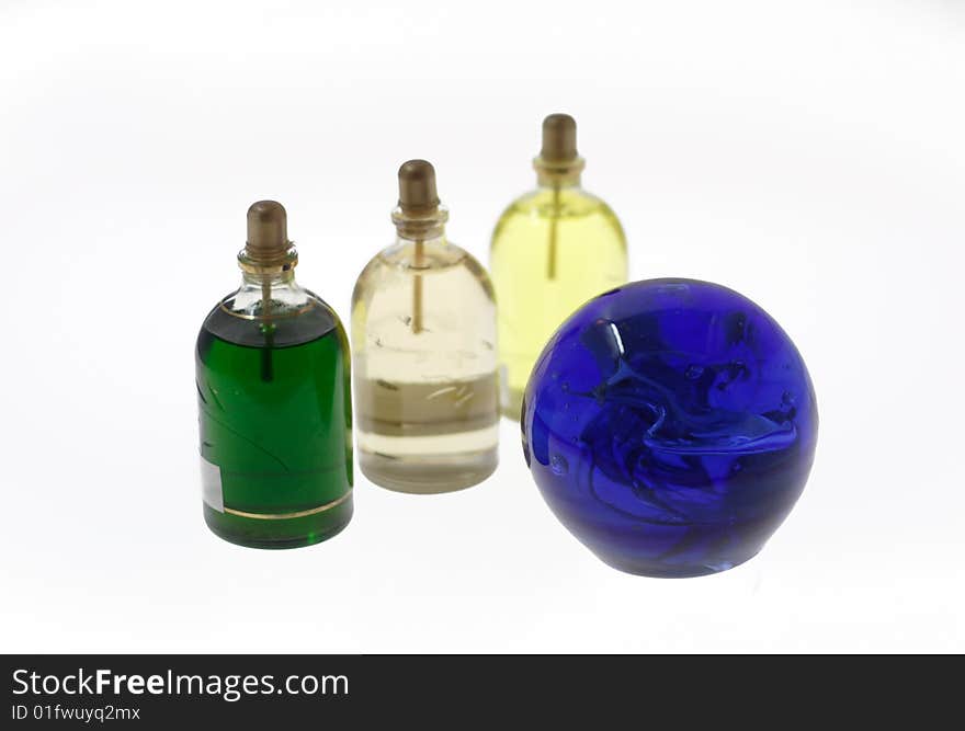 Multi-coloured bottles with oil  and sphere