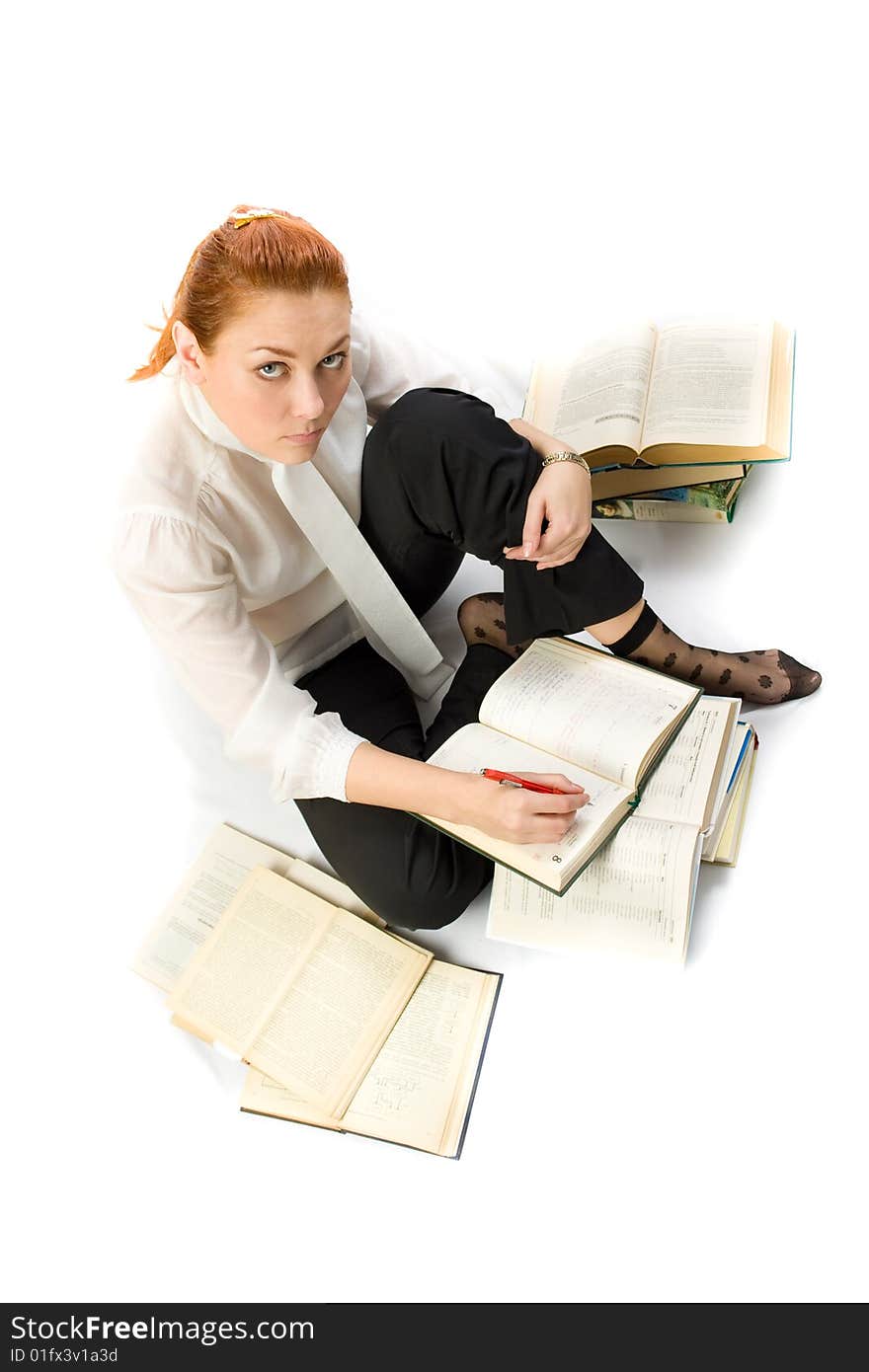 Woman Sitting On Floor With Books.