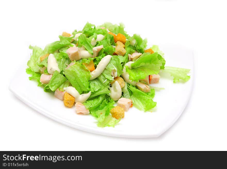 Caesar salad with chicken on white background