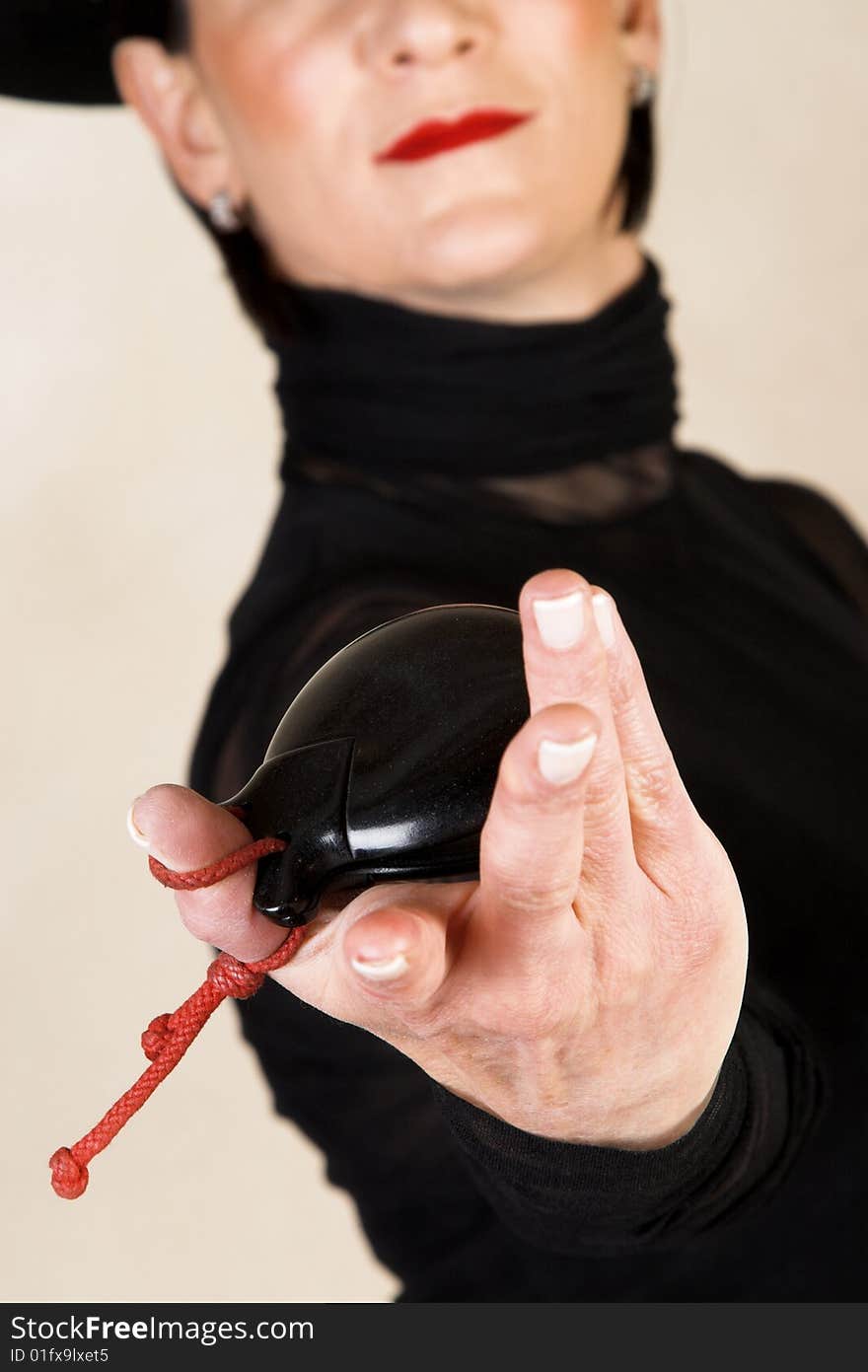 Spanish Dancer in a black costume with hat and accessories