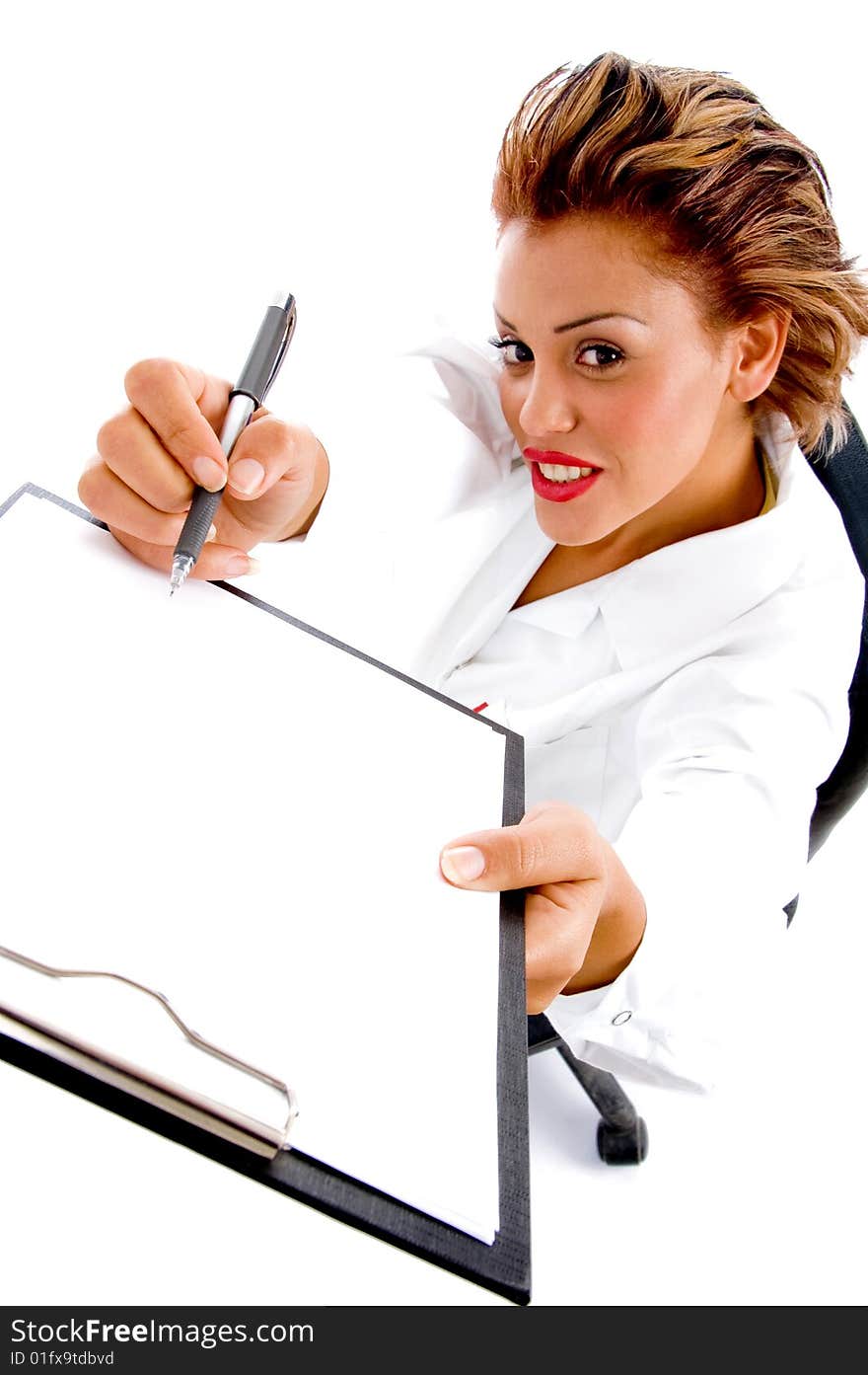 Female doctor writing on notepad