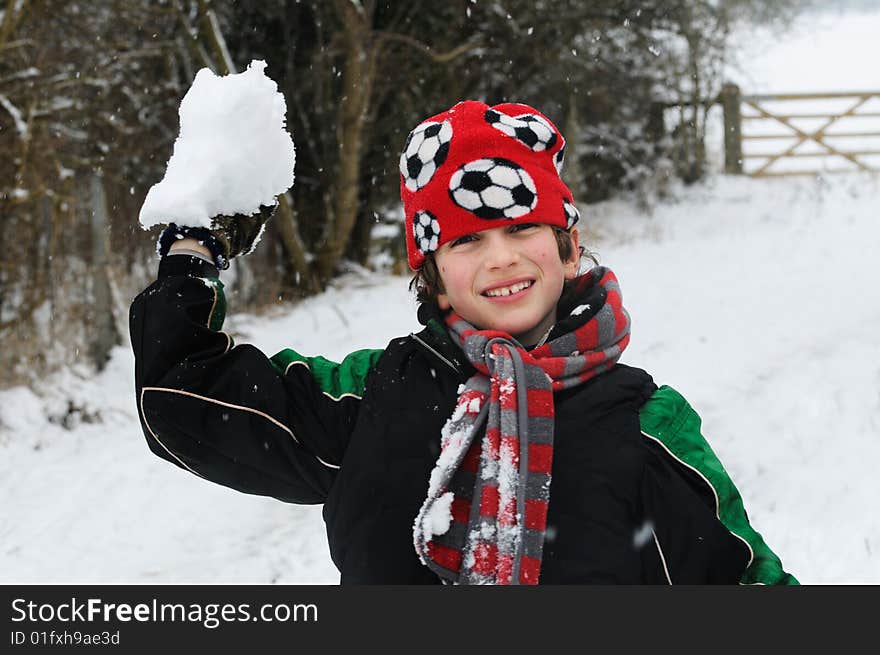 Boy throwing snow