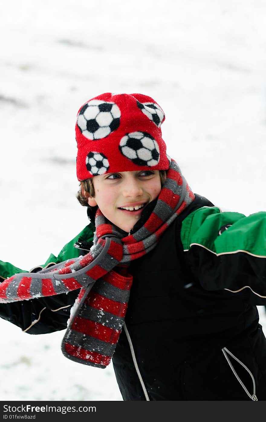 Closeup of boy throwing snowball