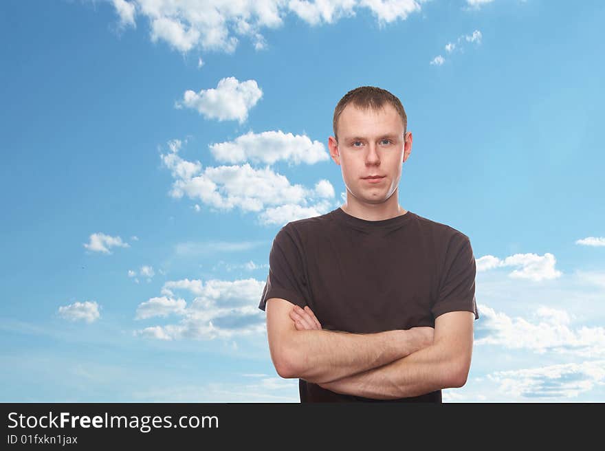 Thoughtful young man with blue sky