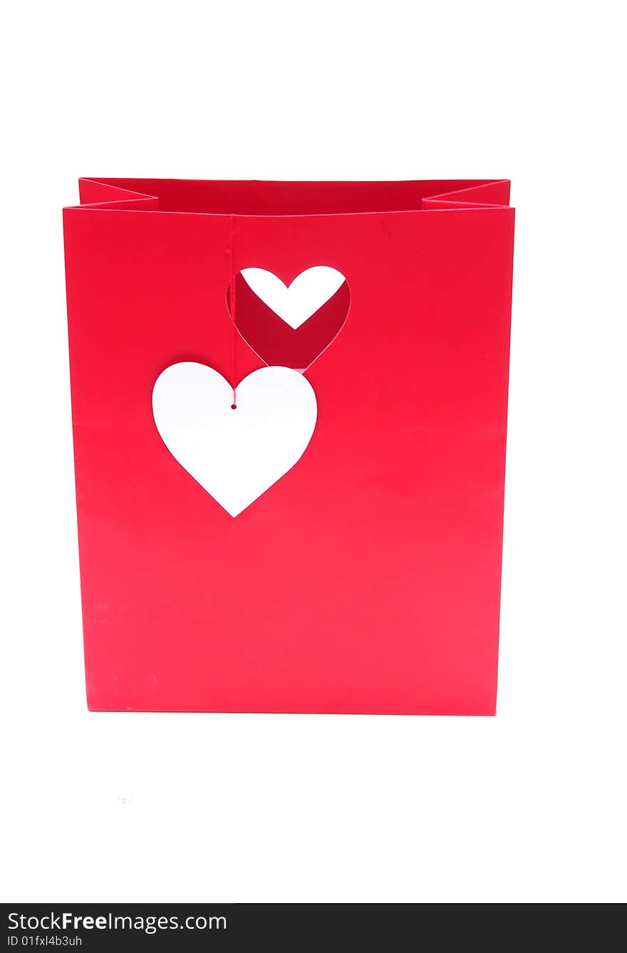 Shot of a red heart gift bag on white