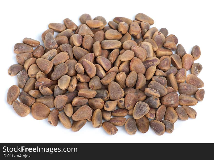 Pile of cedar nuts isolated on the white background