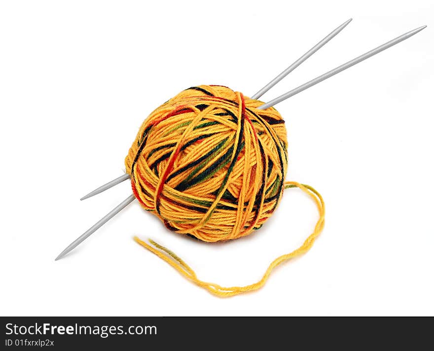 Yellow wool ball with needles