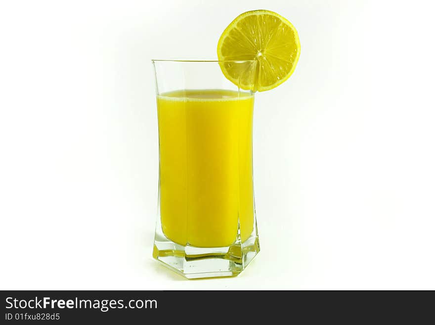 Fresh orange juice in glass and lemon cut. Fresh orange juice in glass and lemon cut