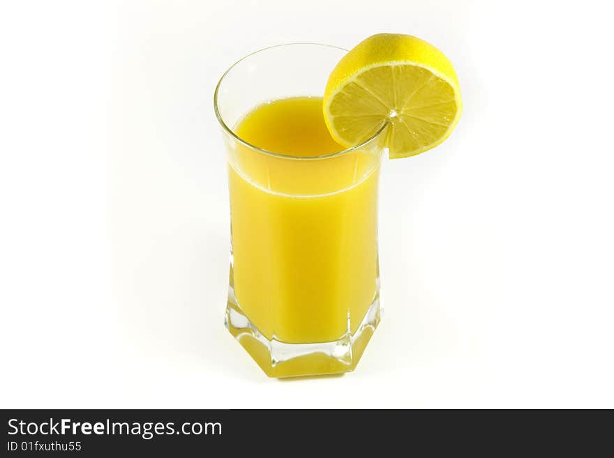 Fresh orange juice on glass with lemon