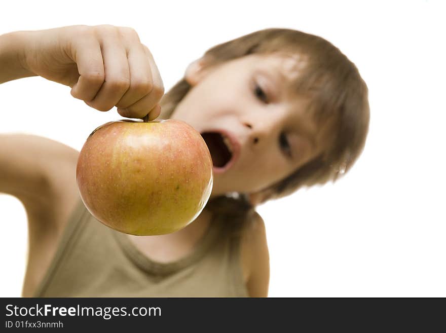 Young boy hold red apple in hand and open his mouth. Young boy hold red apple in hand and open his mouth