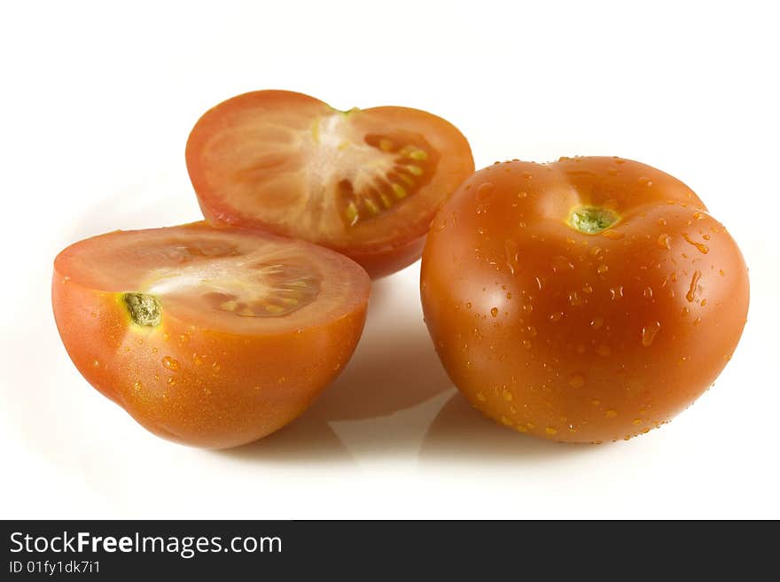 Tomato cut on water droplets