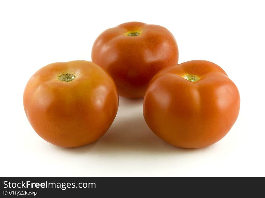 Red tomatoes on white background