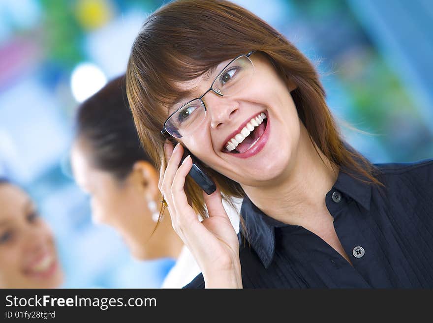 Portrait of young beautiful woman in office environment. Portrait of young beautiful woman in office environment