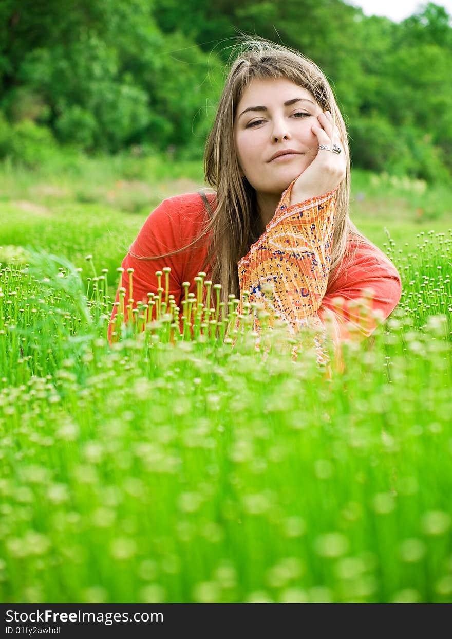 Beautiful young woman in green field. Beautiful young woman in green field