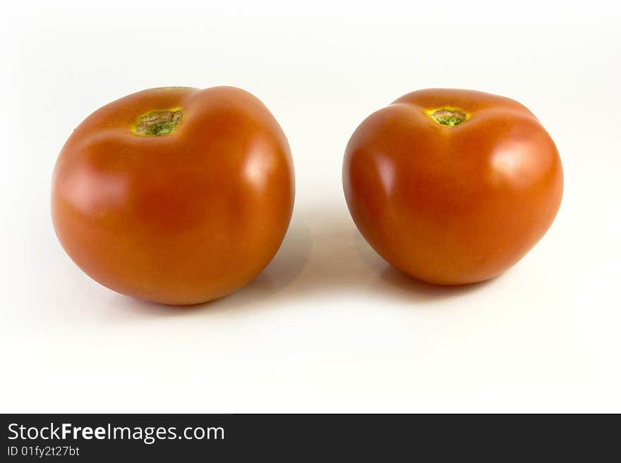 Fresh tomatoes on white background