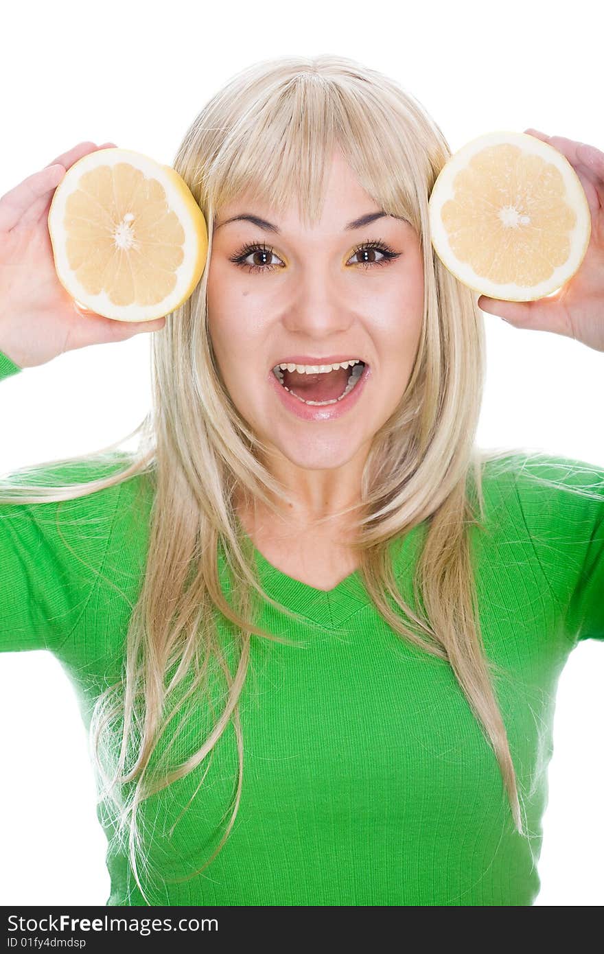 Attractive blonde woman with grapefruit on white