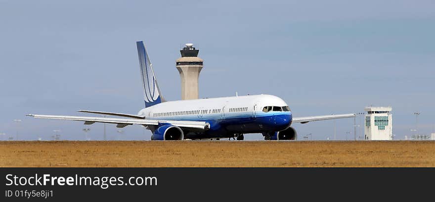 Side view of airplane on runway