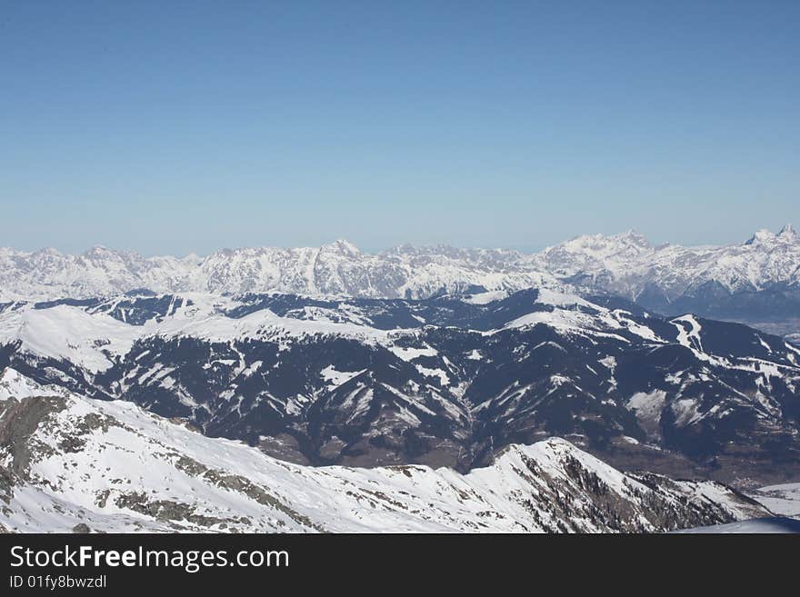 Austria. Mountains. The Alpes.Snow. The sun. Mountain tops.