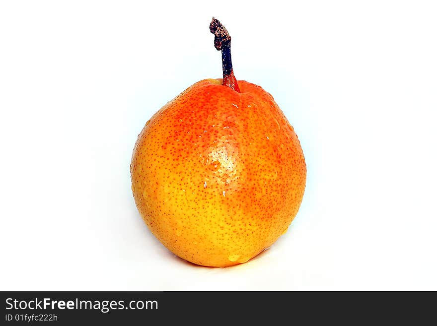 Pear with drops of water on a white background