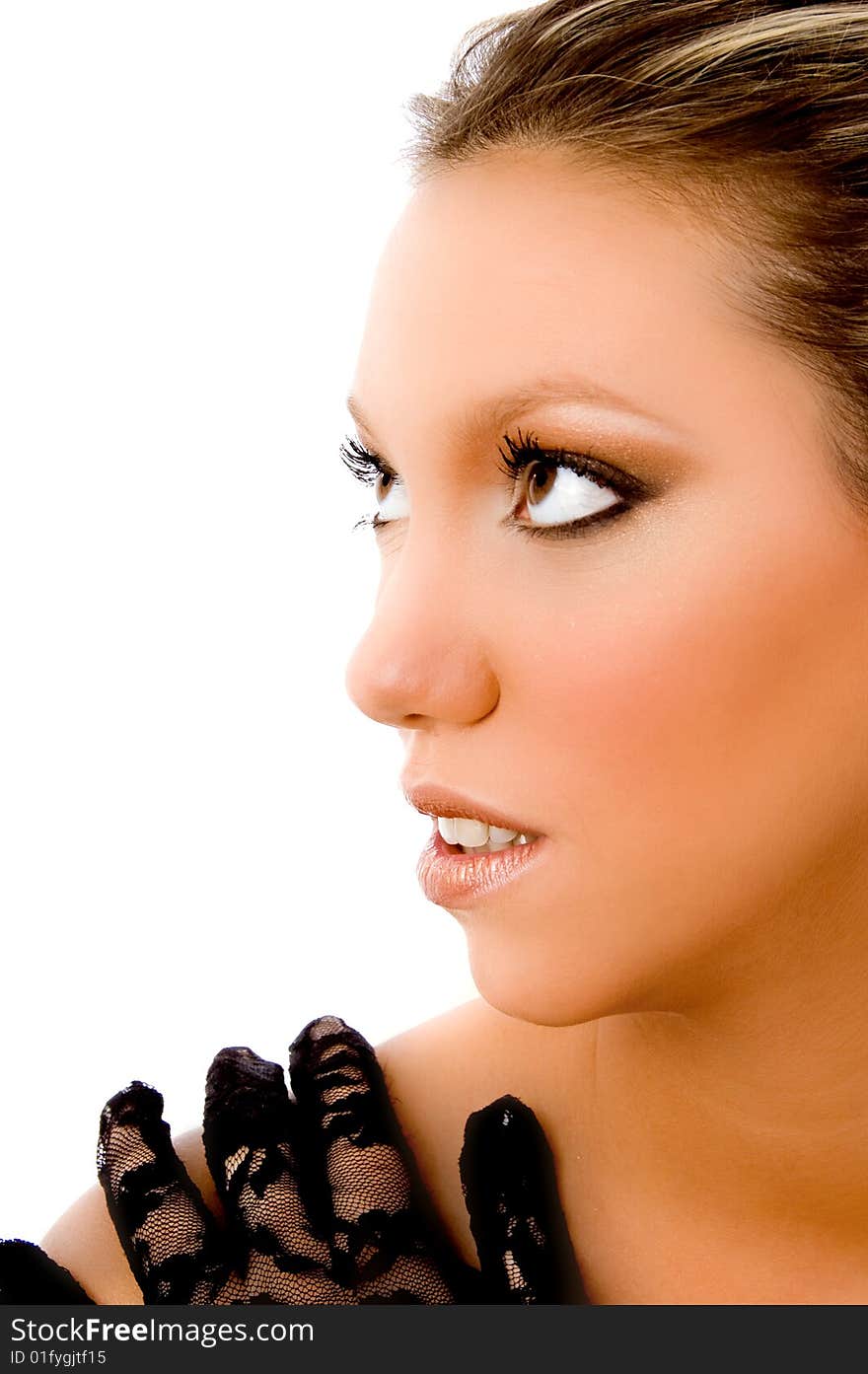 Half length view of young woman looking aside on an isolated background