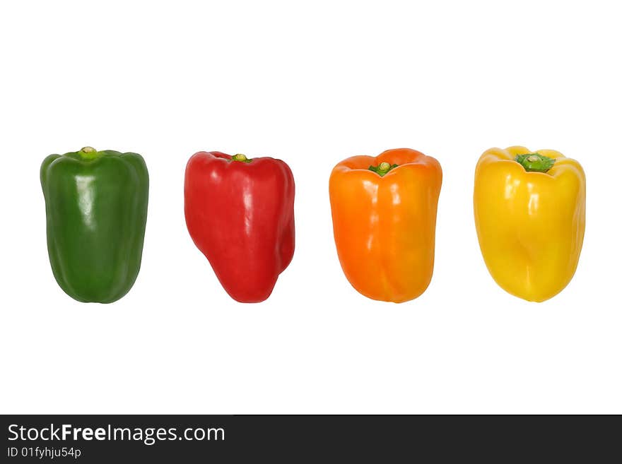 Four peppers in a line in the colors of green, red, orange and yellow, isolated over white background. Four peppers in a line in the colors of green, red, orange and yellow, isolated over white background.