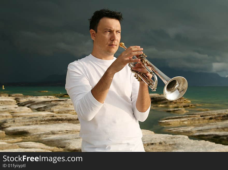 A man playing trumpet outdoor