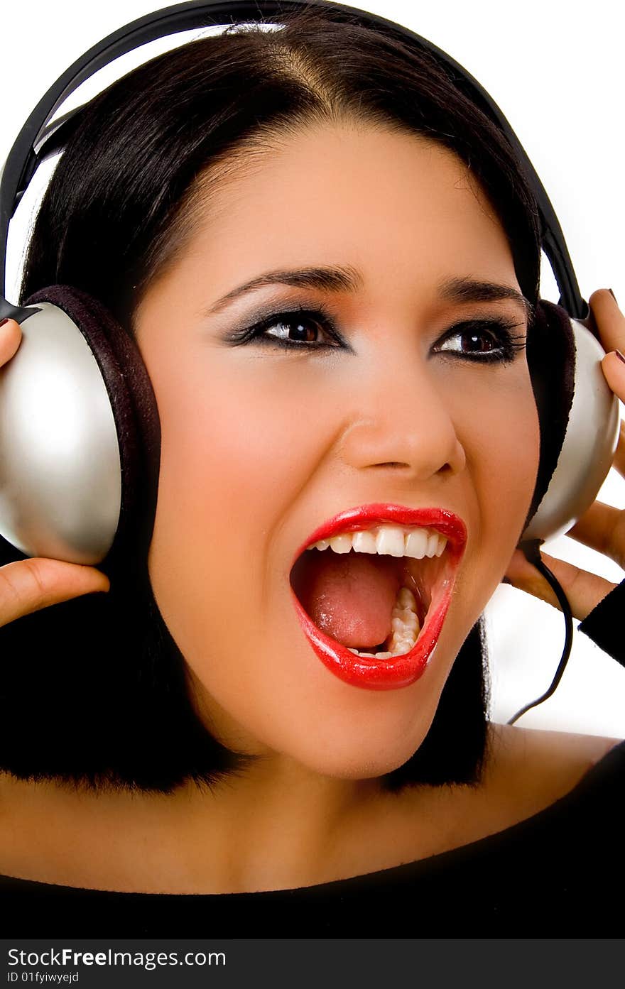 Portrait of happy beautiful female listening music