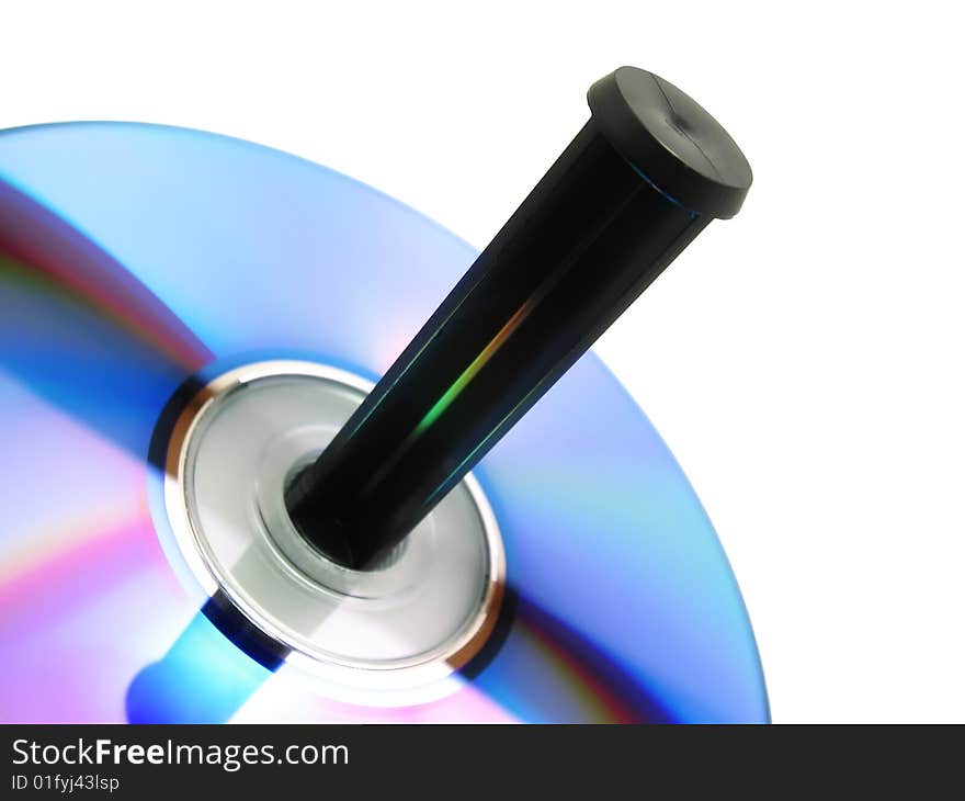 Close-up view of a blank recordable CD placed in a spindle tray isolated over white background (clipping path included). Close-up view of a blank recordable CD placed in a spindle tray isolated over white background (clipping path included)