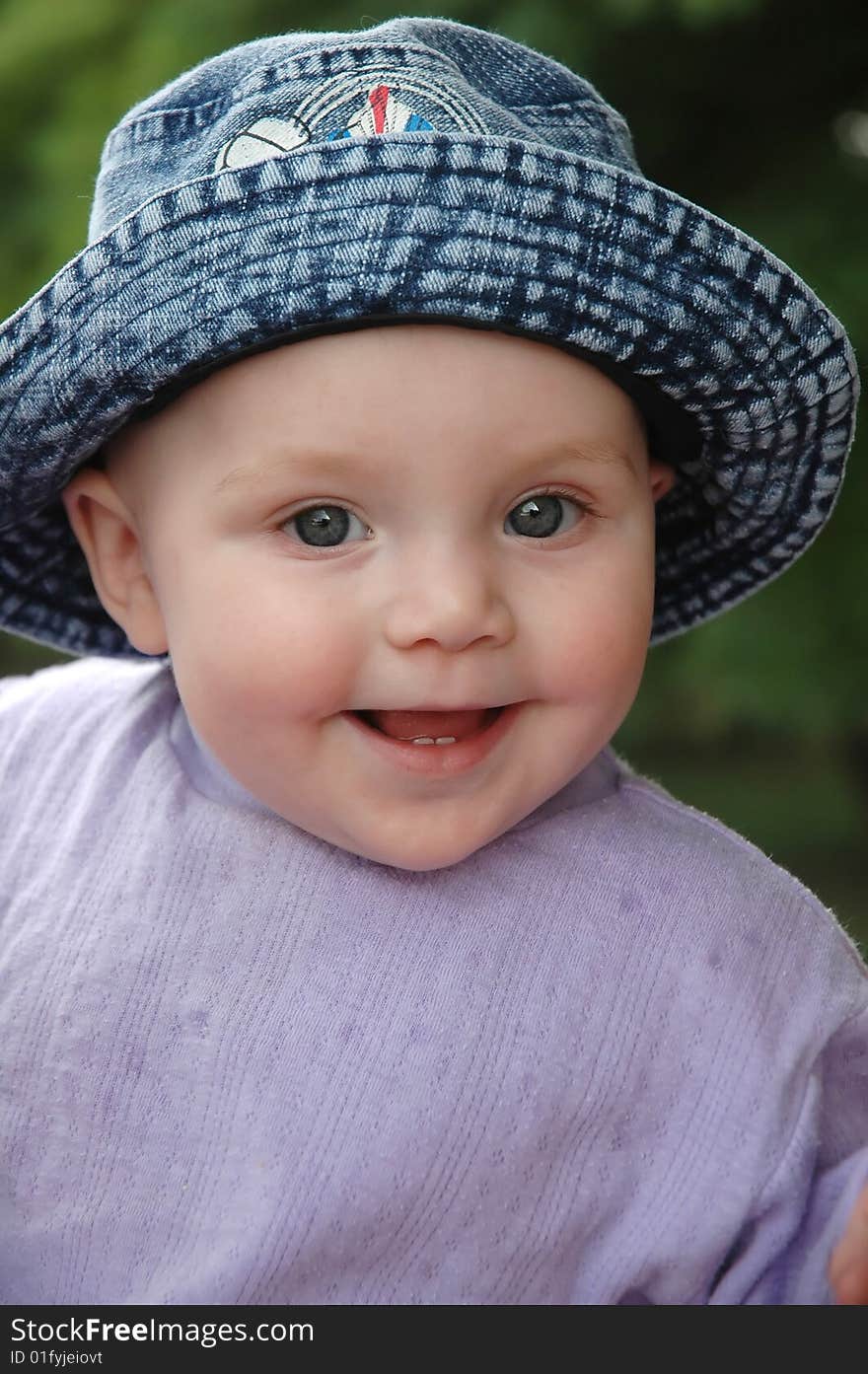 Baby Smiled In Blue Jean Hat