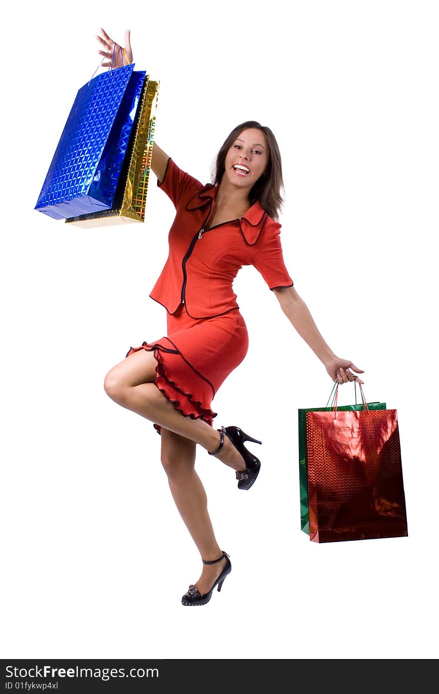 The young beautiful girl with purchases in colour packages during shopping on a white background. The young beautiful girl with purchases in colour packages during shopping on a white background