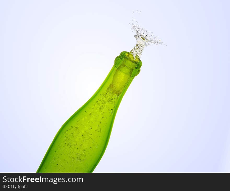 Green champagne bottle with splash of wine flying out of isolated on white. Green champagne bottle with splash of wine flying out of isolated on white