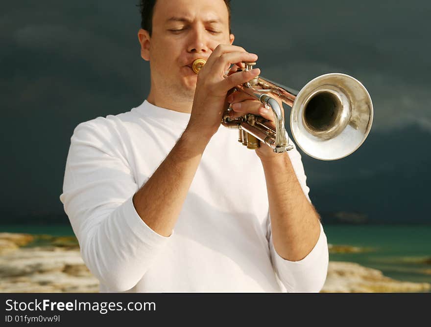 A man playing trumpet outdoor