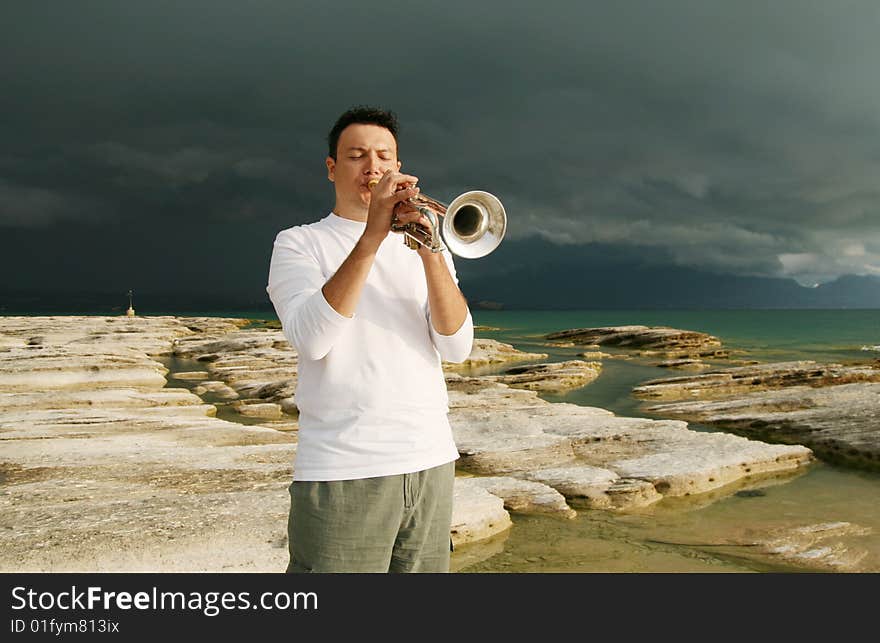 A man playing trumpet outdoor