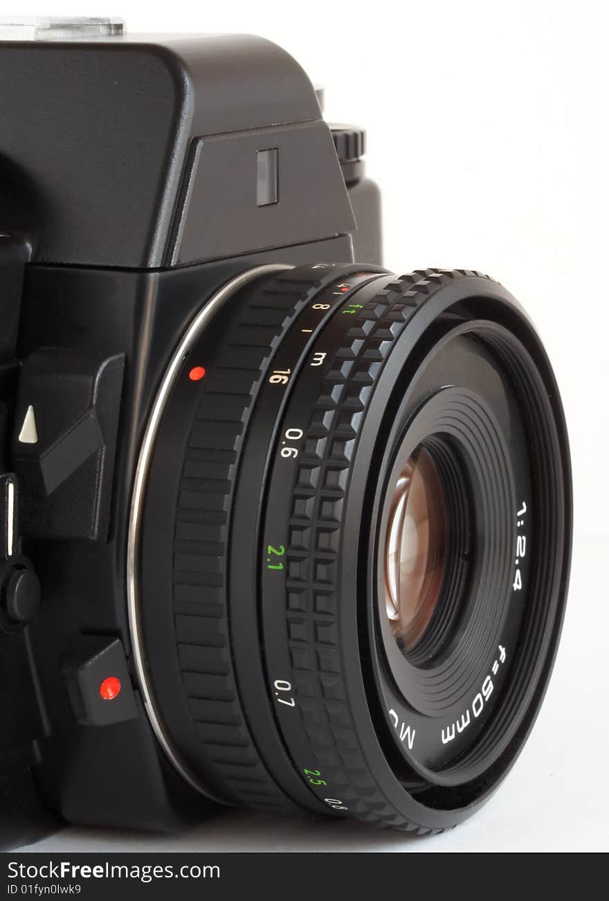 Closeup vintage SLR camera over white background