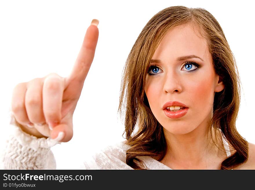 Portrait of young female pointing up on an isolated white background