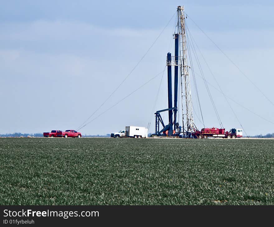 Pulling Unit in the middle of a winter wheat field pulling maintaince on an oil well