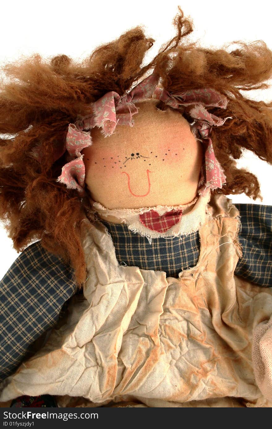 Redheaded dollsmiling on a white background. Redheaded dollsmiling on a white background.